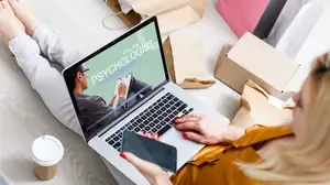 Person attending an online psychology session in Australia using a laptop at home