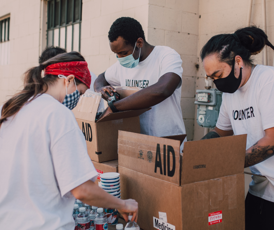 A group of volunteers engaged in acts of kindness.