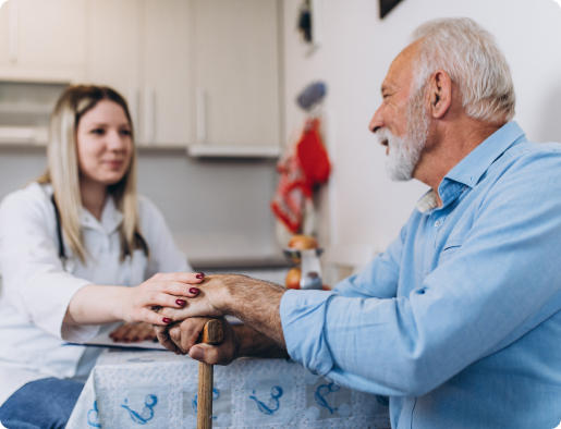 Elderly man discussing cognitive health with a healthcare professional during a consultation, illustrating aging, memory concerns, and early assessment of cognitive decline