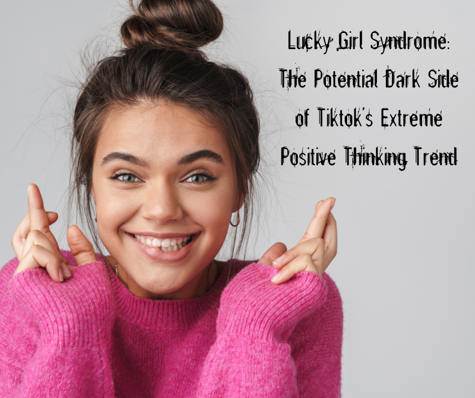 Cheerful girl in pink sweater smiling with fingers crossed. Main image for an article on the potential dark side of TikTok’s Lucky girl syndrome trend.