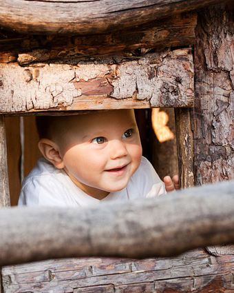 baby playing peekaboo