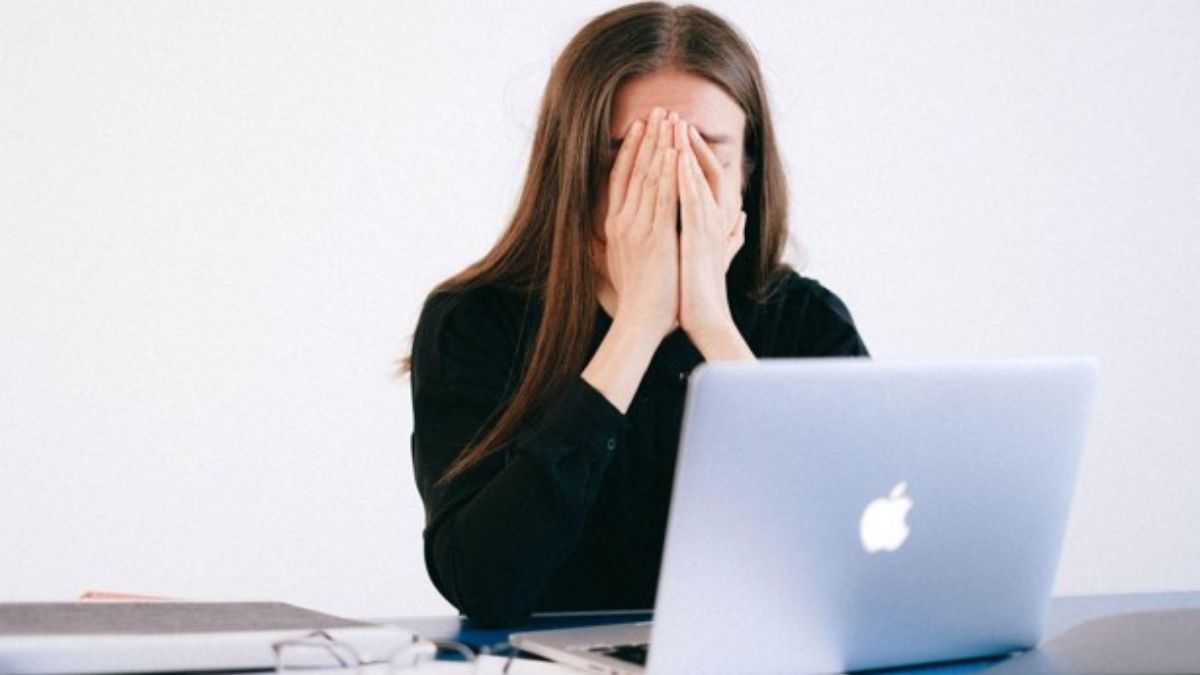 Woman covering her face while sitting at a laptop, illustrating emotional overwhelm and the need for effective BPD therapy. Woman covering her face while sitting at a laptop, illustrating emotional overwhelm and the need for effective BPD therapy.
