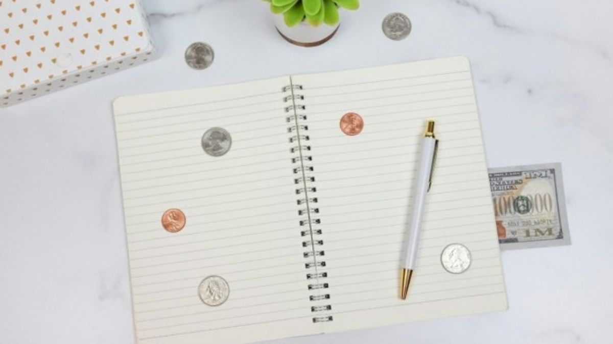 Notebook, pen, coins, and cash on a desk, illustrating financial self-control and better money habits. Notebook, pen, coins, and cash on a desk, illustrating financial self-control and better money habits.
