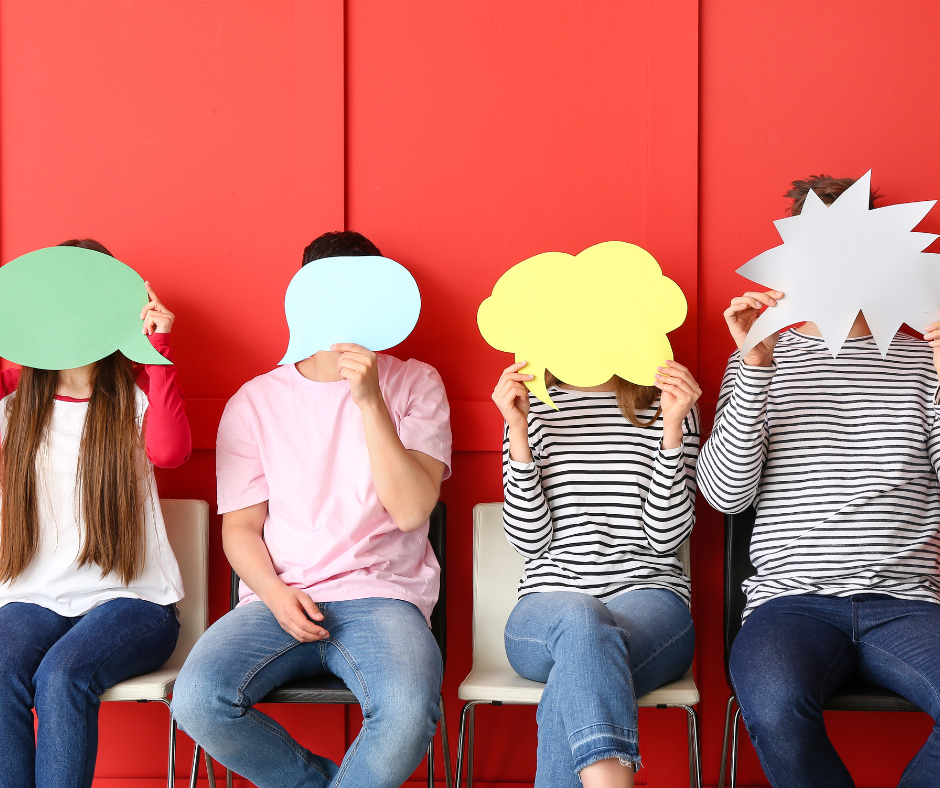 Young people holding blank speech bubbles