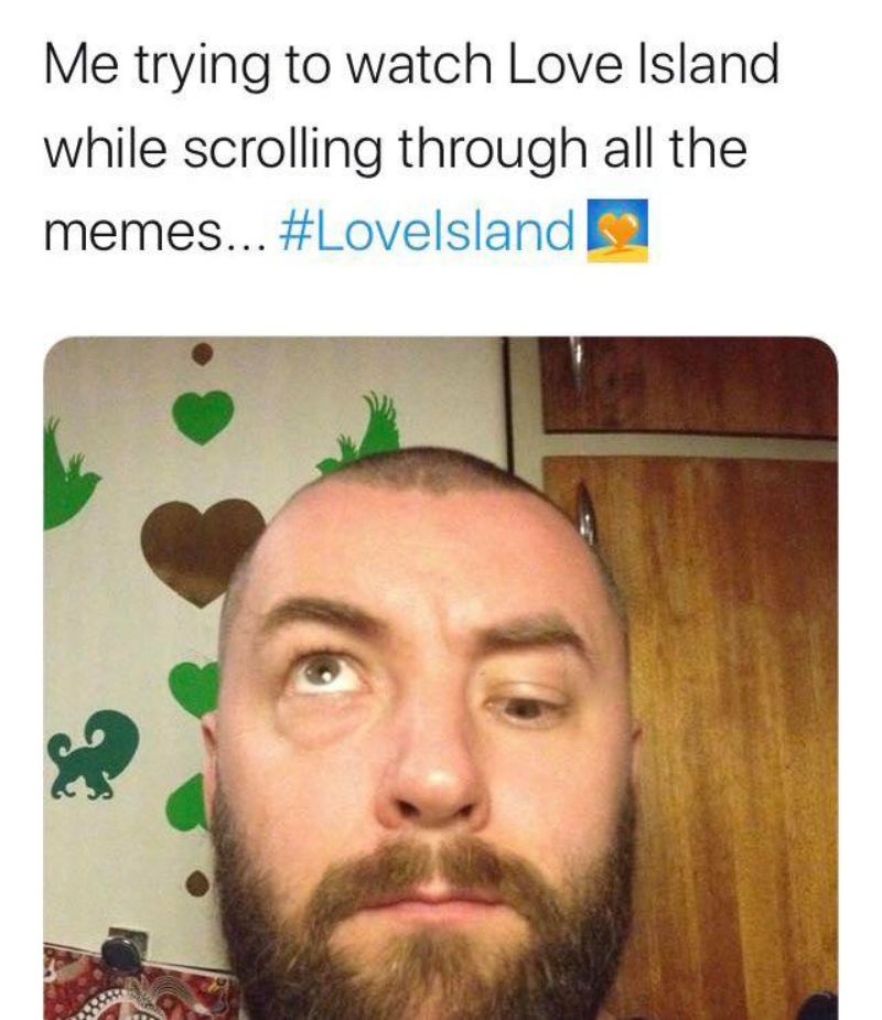 Meme with a bearded man crossing his eyes under the caption ‘Me trying to watch Love Island while scrolling through all the memes… #LoveIsland,’ highlighting the show’s nonstop social-media chatter.