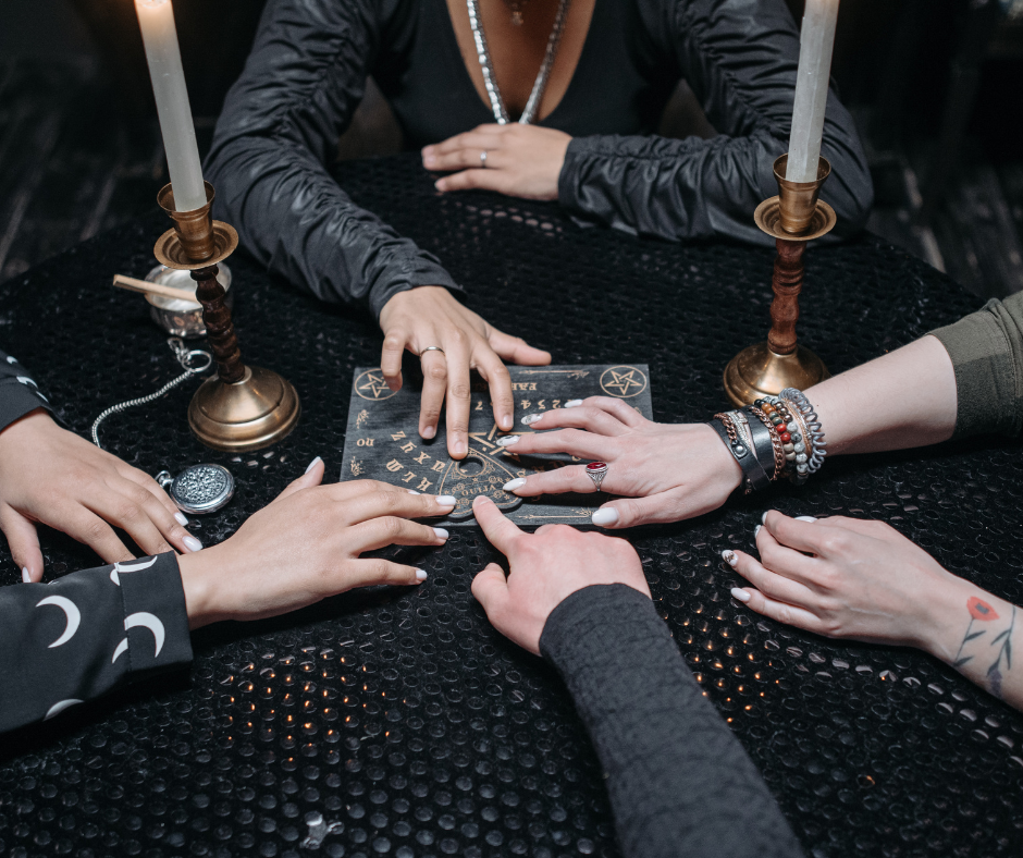 hands on a Ouija board