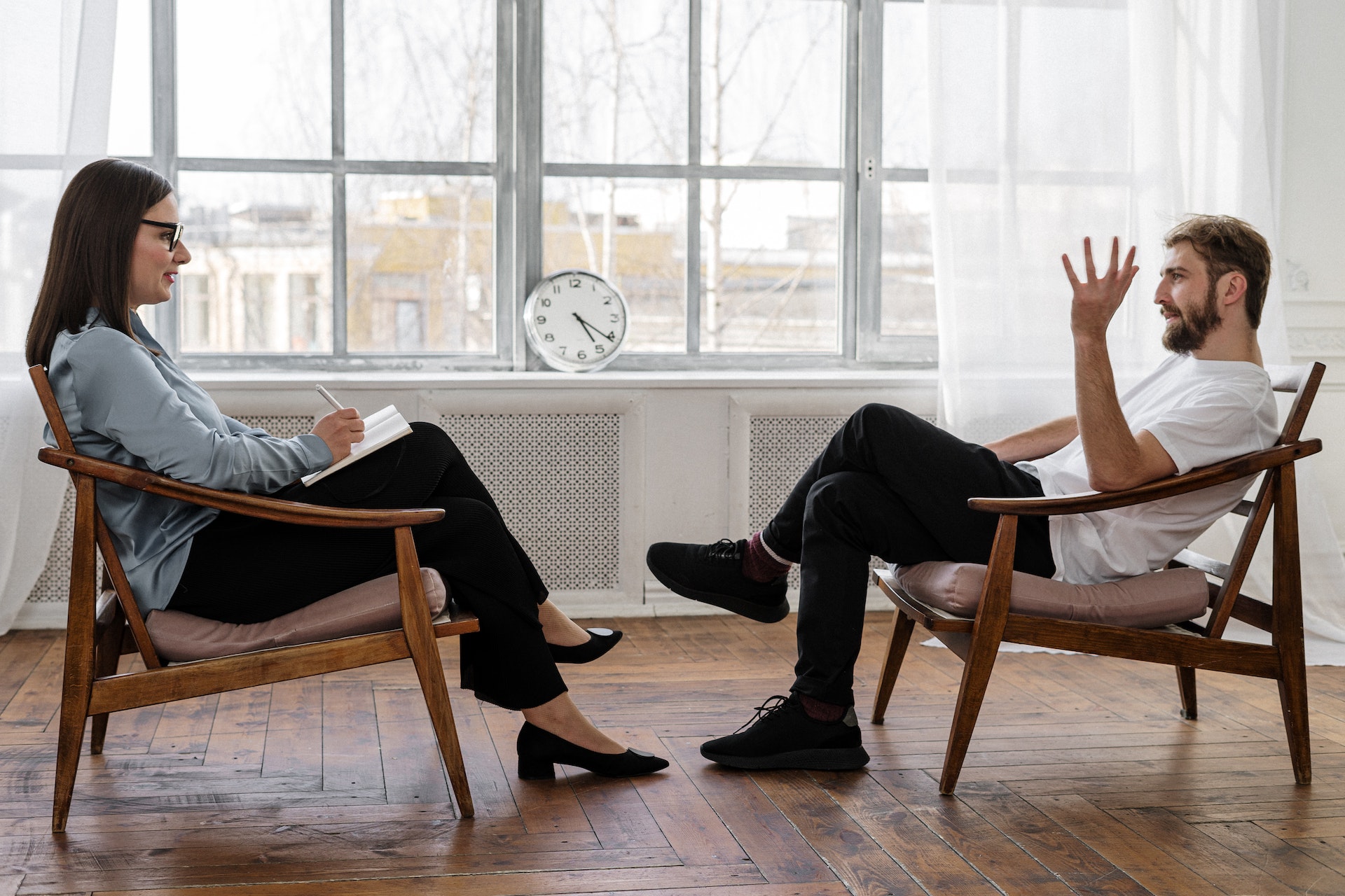 Sports psychologist talking with client